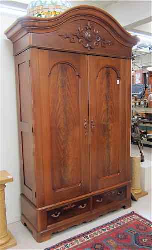 Appraisal: LARGE VICTORIAN WALNUT DOUBLE-DOOR WARDROBE American th century having a