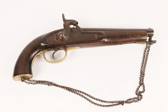 Appraisal: AN OLD FLINTLOCK PISTOL with brass mounts and wooden stock