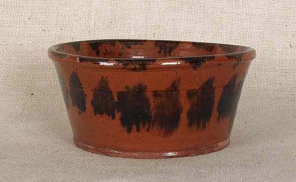 Appraisal: Pennsylvania redware mixing bowl th c with manganese splash decoration