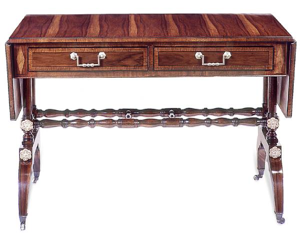 Appraisal: A Regency style mahogany and rosewood sofa table Overall line