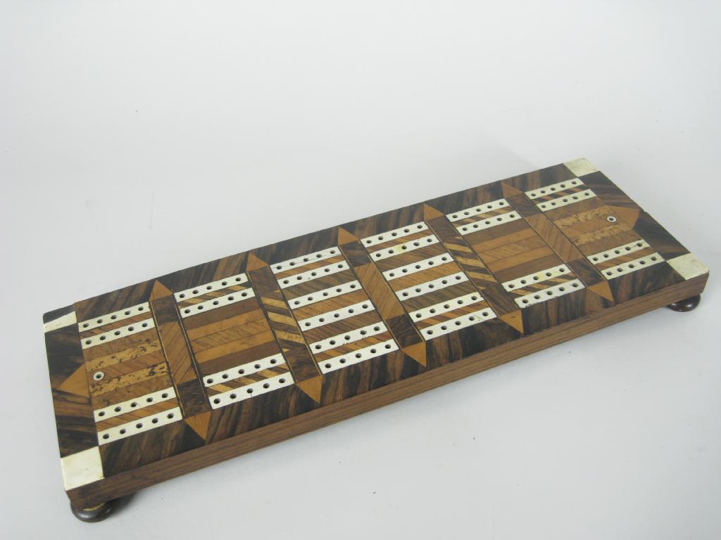 Appraisal: A large Victorian inlaid Cribbage Board with counter container underneath