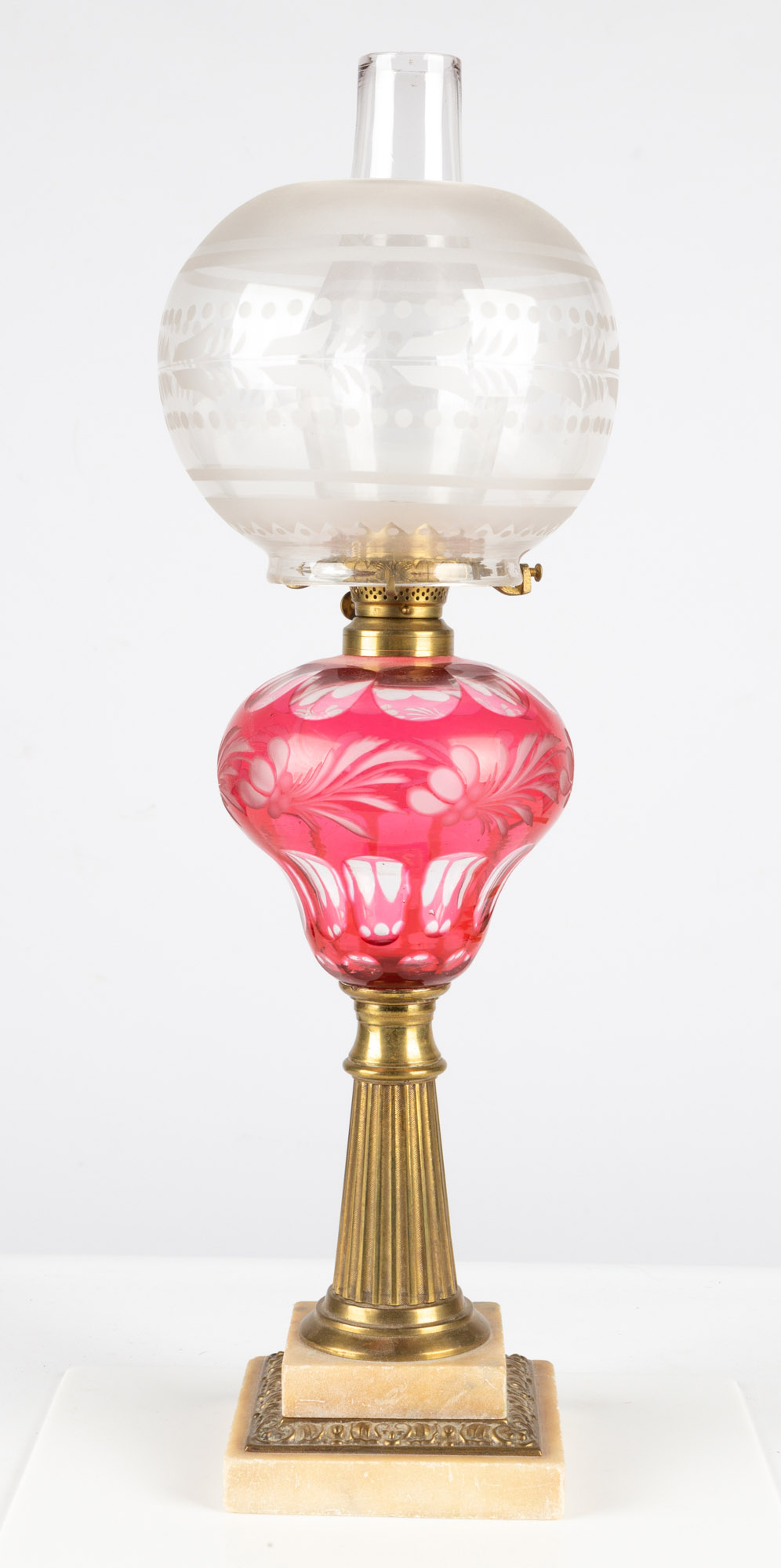 Appraisal: CRANBERRY OVERLAY OIL LAMP circa red cut to clear leaf