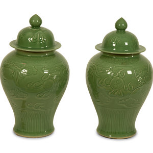 Appraisal: A Pair of Celadon Glazed Covered Jars TH CENTURY Height