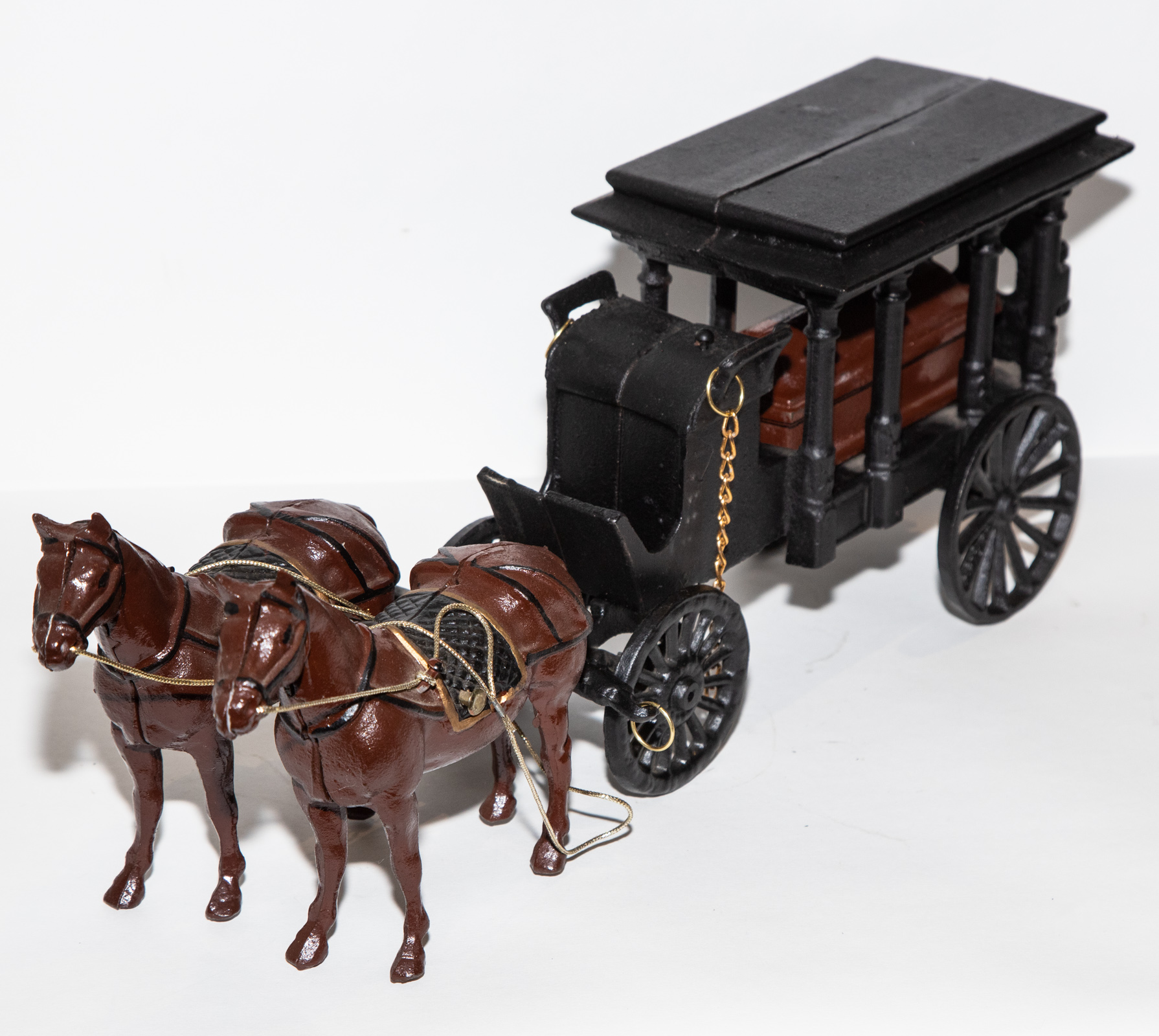 Appraisal: PAINTED CAST IRON HORSE DRAWN HEARSE With removable casket