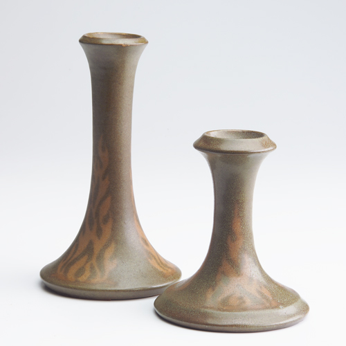 Appraisal: WALRATH Two corseted candlesticks matte-painted with a stylized flame design