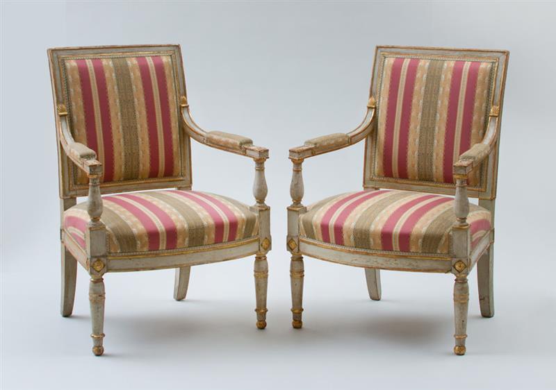 Appraisal: PAIR OF DIRECTOIRE GREY PAINTED AND PARCEL-GILT FAUTEUILS LA REINE