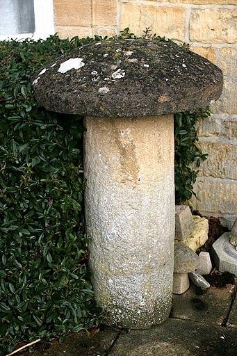 Appraisal: A staddle stone with circular top and a cylindrical base