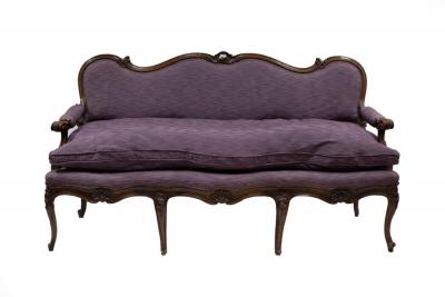 Appraisal: An Italian walnut sofa with carved and moulded frame the