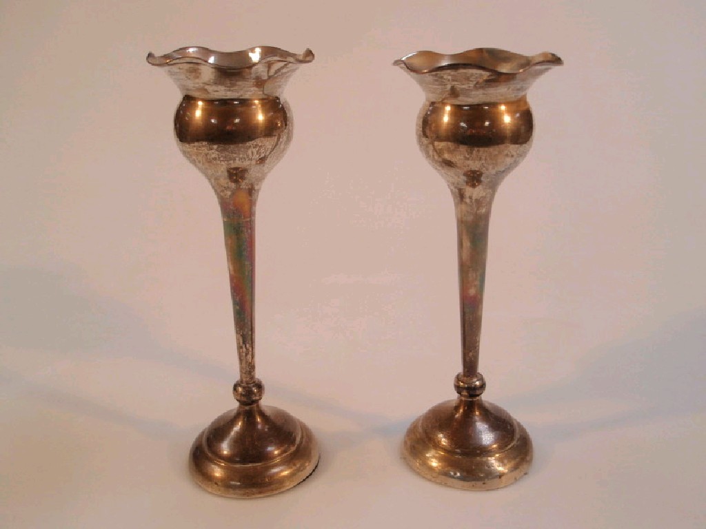 Appraisal: A pair of George V silver thistle shape vases Birmingham