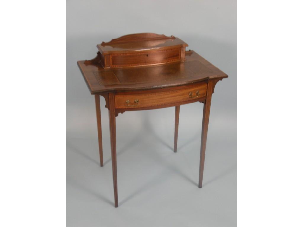 Appraisal: An Edwardian mahogany and satinwood cross banded writing table the