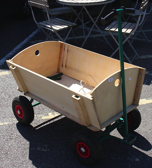 Appraisal: A CHILD'S PULL ALONG HAND CART with pneumatic tyres the