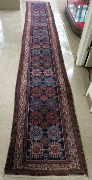 Appraisal: SEMI-ANTIQUE PERSIAN RUNNER Hamadan region northwest Iran repeating geometric pattern