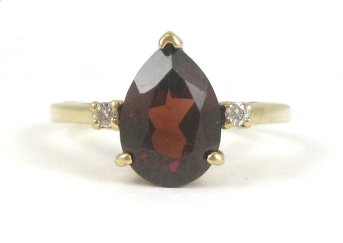 Appraisal: GARNET DIAMOND AND FOURTEEN KARAT GOLD RING set with two