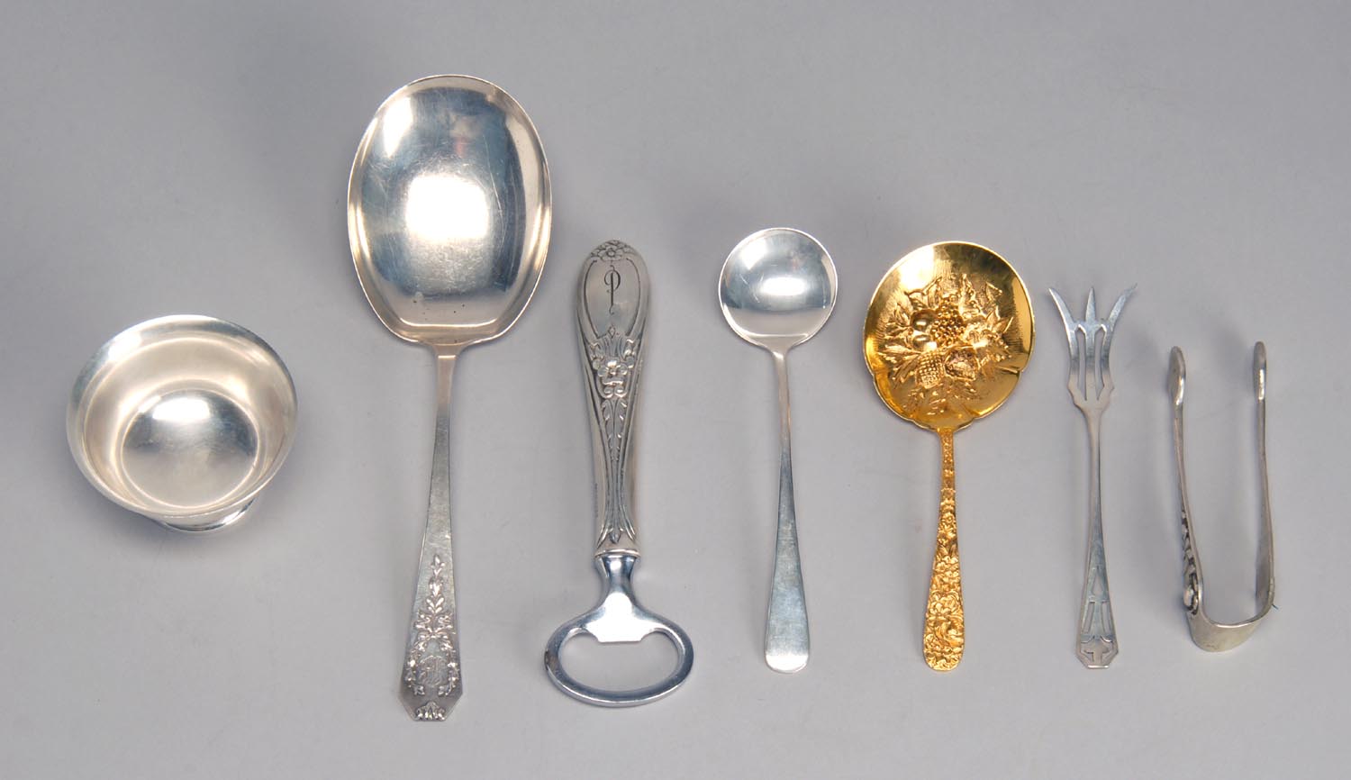 Appraisal: SIX STERLING SILVER ITEMS together with a gold-plated berry spoon