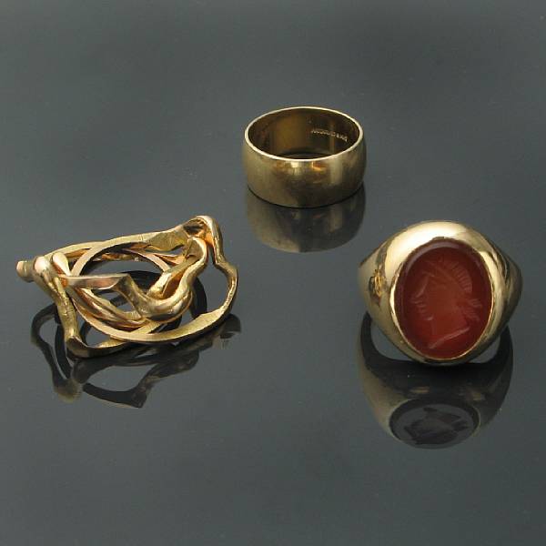 Appraisal: A collection of gold rings featuring one intaglio ring one