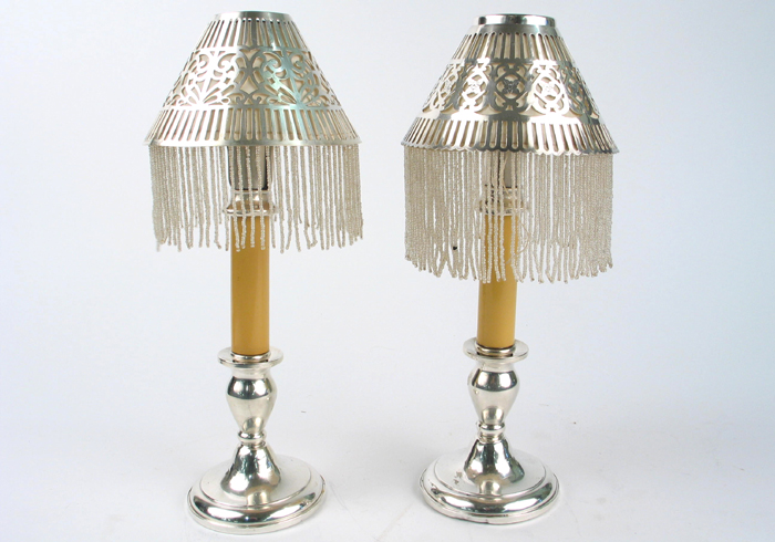 Appraisal: PAIR OF AMERICAN STERLING SILVER CANDLE LAMPS having pierced silver