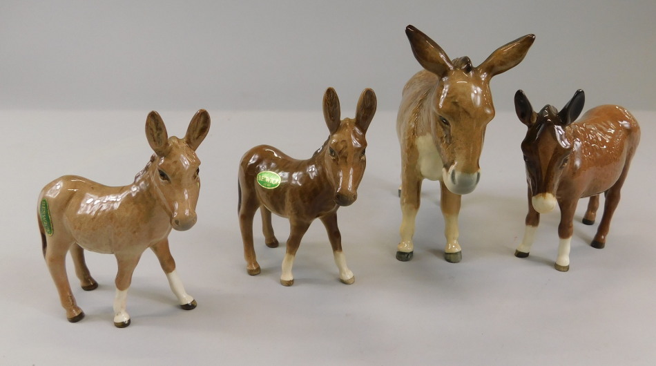 Appraisal: Four Beswick donkey figures to include model number B cm