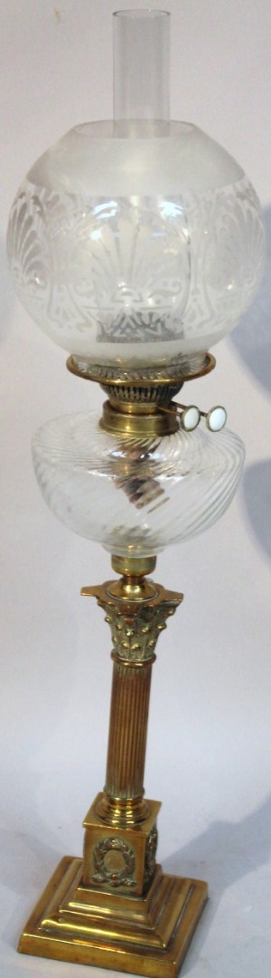 Appraisal: An Edwardian brass frosted and clear glass oil lamp with