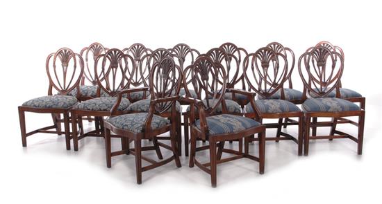 Appraisal: Hepplewhite style carved mahogany shieldback chairs set of fourteen strap