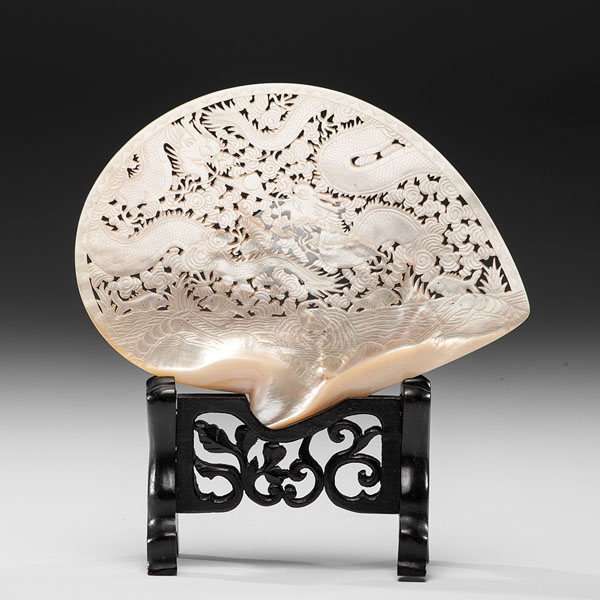 Appraisal: Chinese Carved mother-of-pearl shell with dragon motifs resting on a