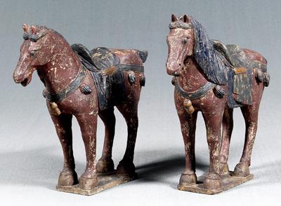 Appraisal: Two Chinese carved wood horses Tang style surface with crackled