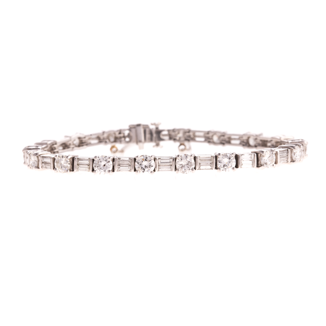 Appraisal: An Alternating Round Baguette Diamond Bracelet Platinum straight line bracelet