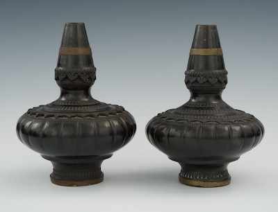 Appraisal: A Pair of Oriental Black Pottery Temple Vases with Brass