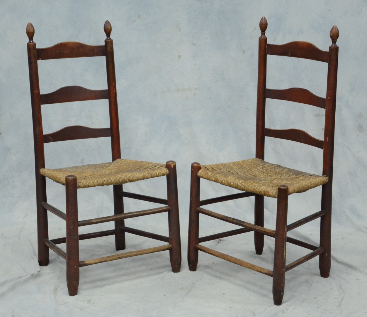 Appraisal: Pr slat ladderback checkered rush seat chairs attributed to the