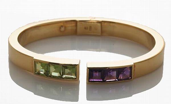 Appraisal: An amethyst peridot and k gold bangle bracelet weighing approximately