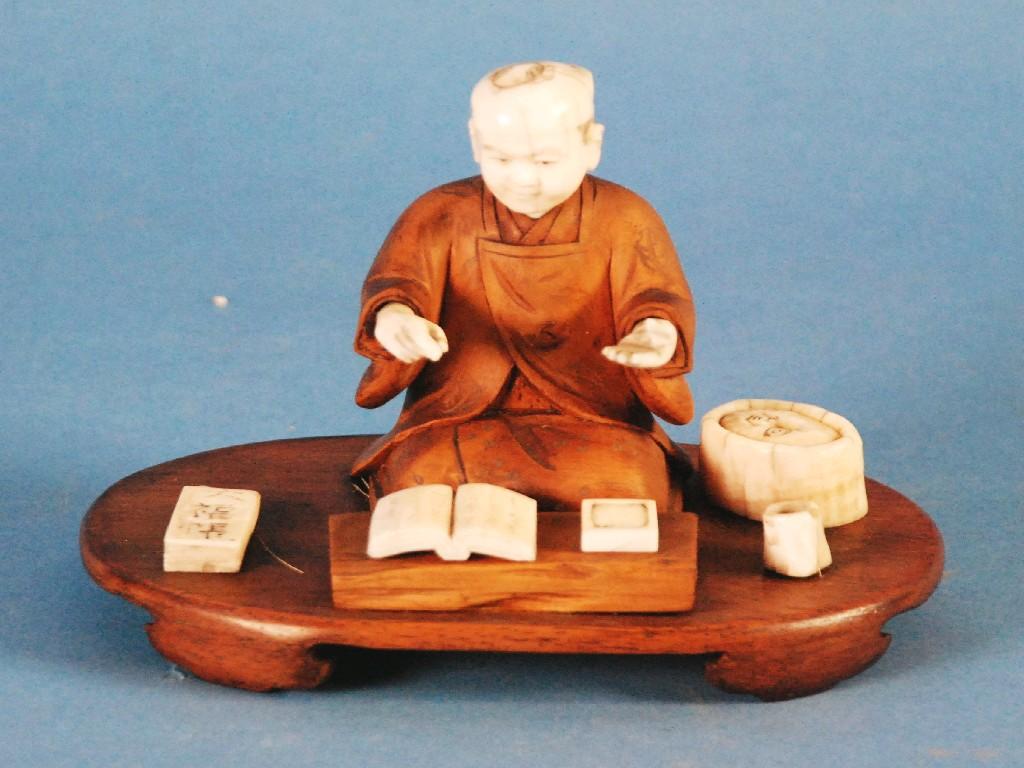 Appraisal: JAPANESE MEIJI PERIOD CARVED WOOD AND IVORY FIGURE OF CALLIGRAPHER