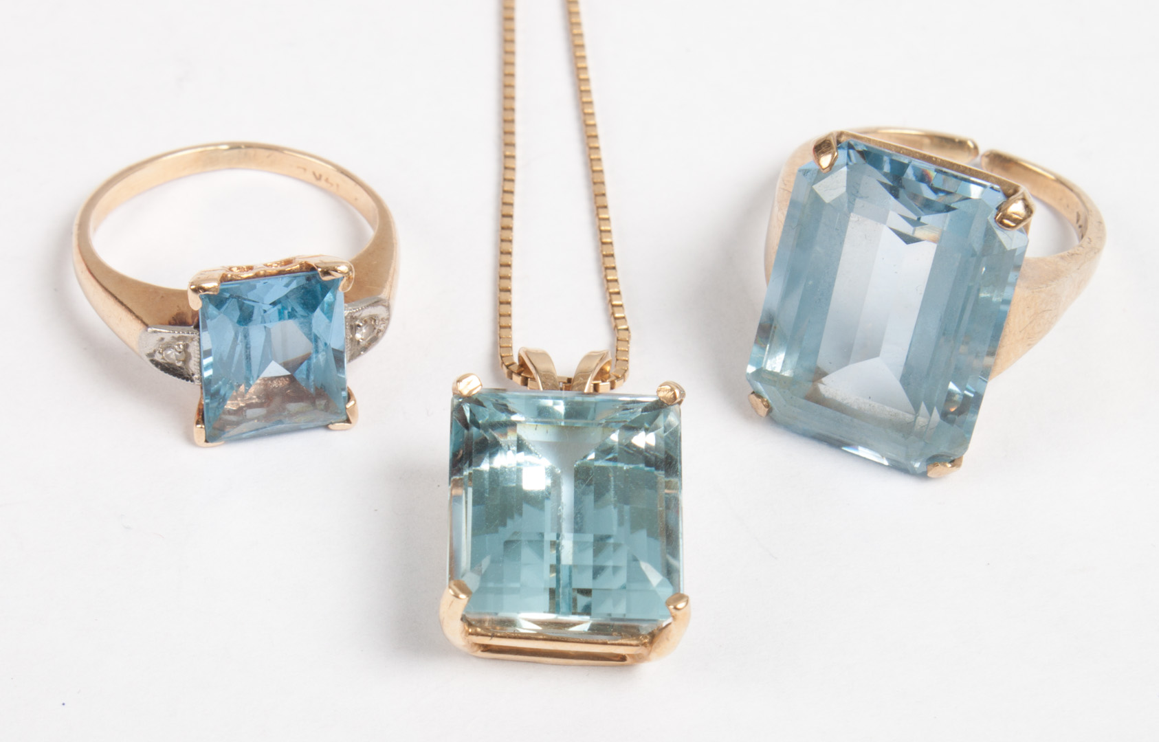 Appraisal: Three gold and blue topaz jewelry items K gold emerald