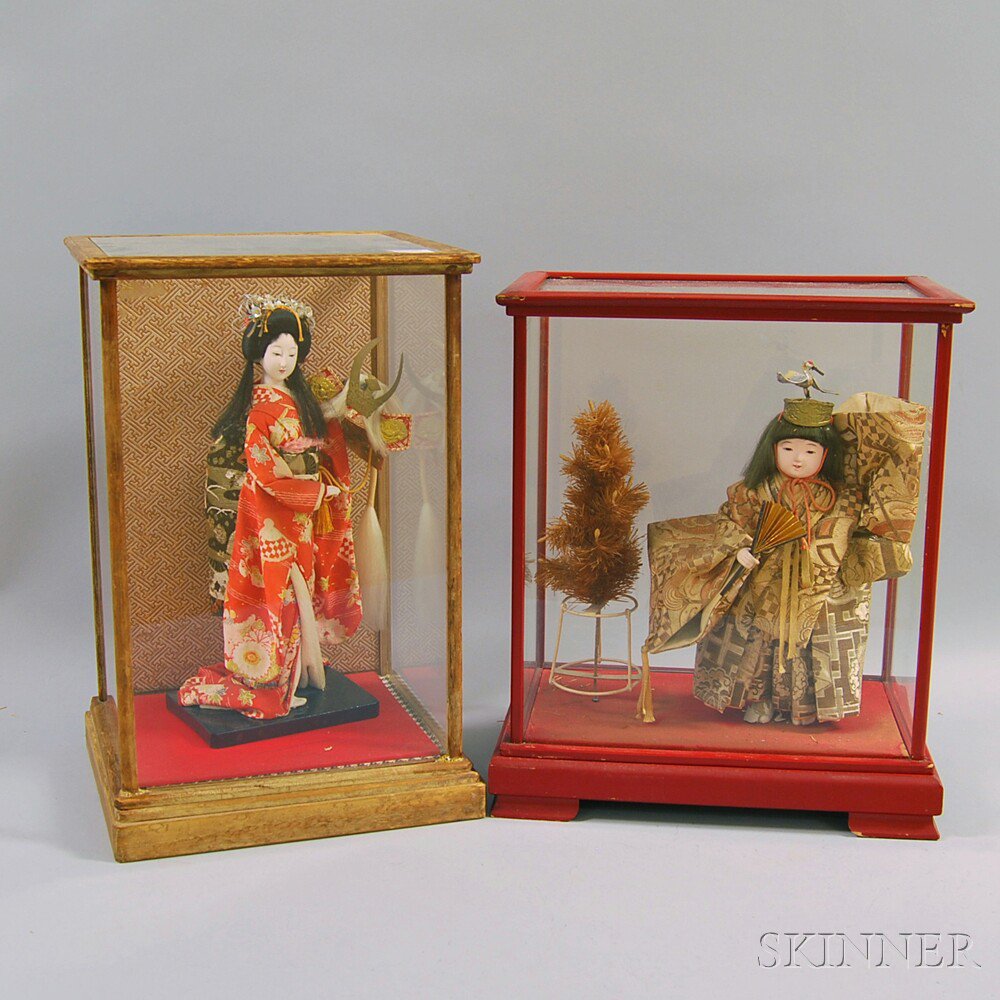 Appraisal: Two Cased Composition Asian Dolls Wearing National Silk Costumes overall