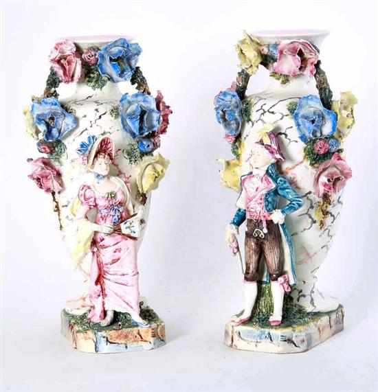 Appraisal: Pair ceramic figural vases circa romantic figures standing beside large