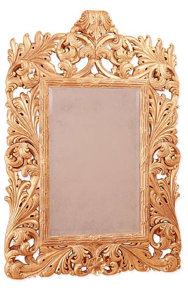 Appraisal: A George III style giltwood mirror Boldly carved with scrolled