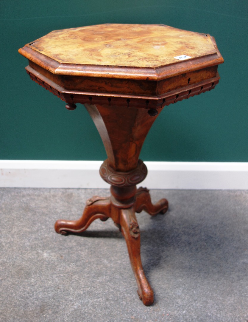 Appraisal: A Victorian figured walnut trumpet shaped work table on a