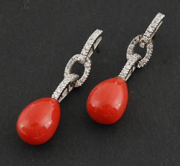 Appraisal: A pair of diamond and coral pendant earrings In the