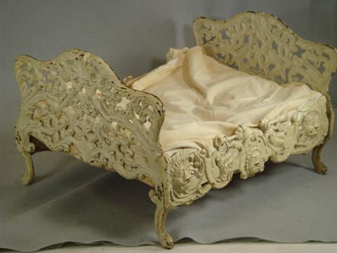 Appraisal: Cast iron doll bed floral and bird design in ends