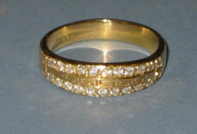 Appraisal: A GENTLEMAN'S DIAMOND SET HALF HOOP ETERNITY RING the ct