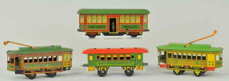 Appraisal: TIN TOY TROLLEY GROUPING Lithographed tin trolley lot includes Main