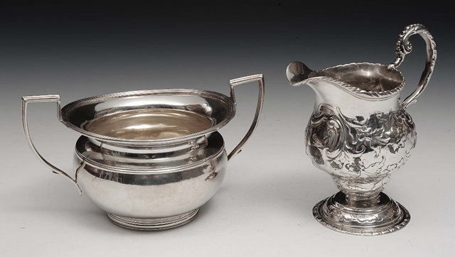 Appraisal: A Georgian silver helmet shaped cream jugof baluster form on