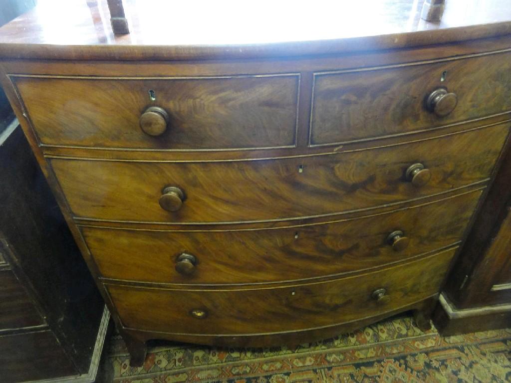 Appraisal: A Victorian mahogany bow front chest of three long and