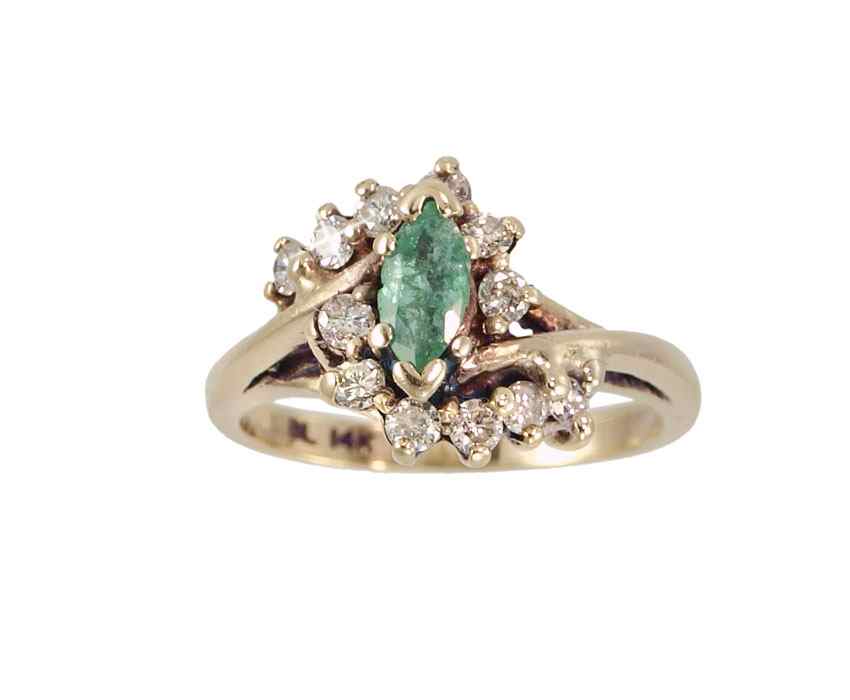 Appraisal: K EMERALD AND DIAMOND RING K yellow gold ring centers