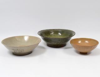 Appraisal: GROUP OF THREE GLAZED POTTERY BOWLS Chinese Each of circular