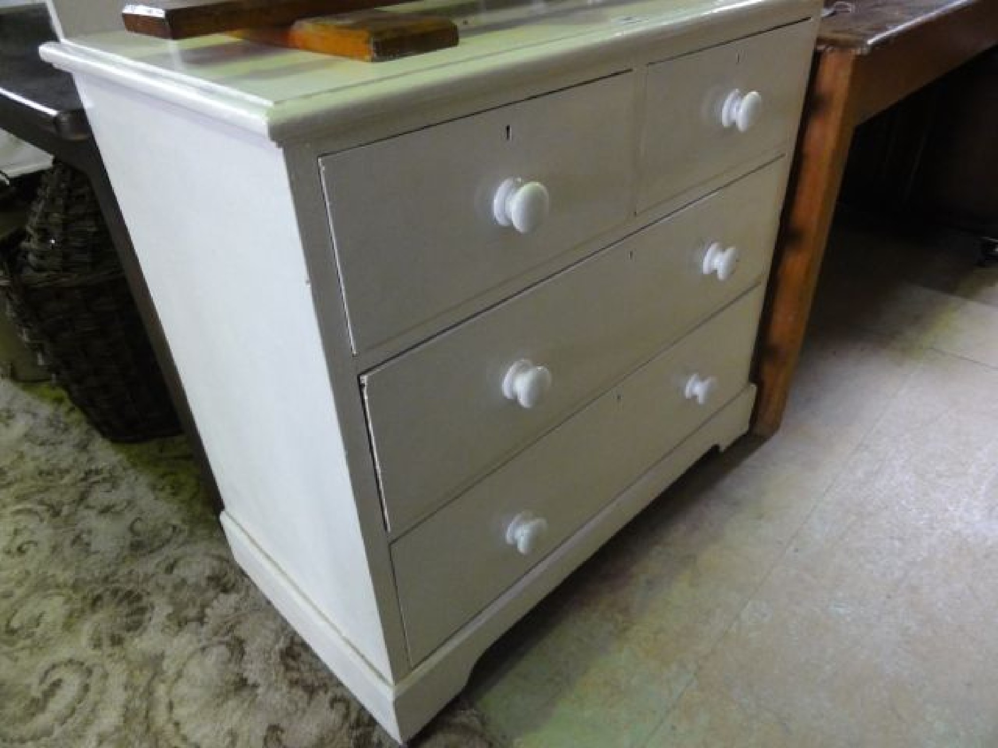 Appraisal: A Victorian pine dressing chest with painted finish of two