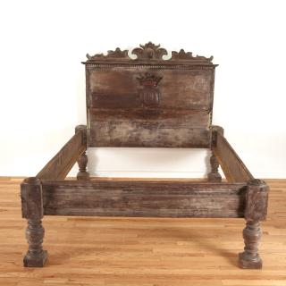 Appraisal: Italian Baroque carved walnut bed with crest Italian Baroque carved