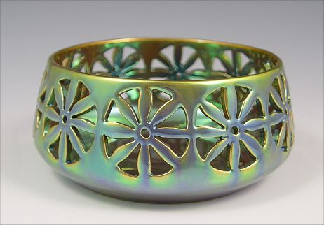 Appraisal: ZSOLNAY IRIDESCENT POTTERY BOWL reticulated body green iridescent glaze ''