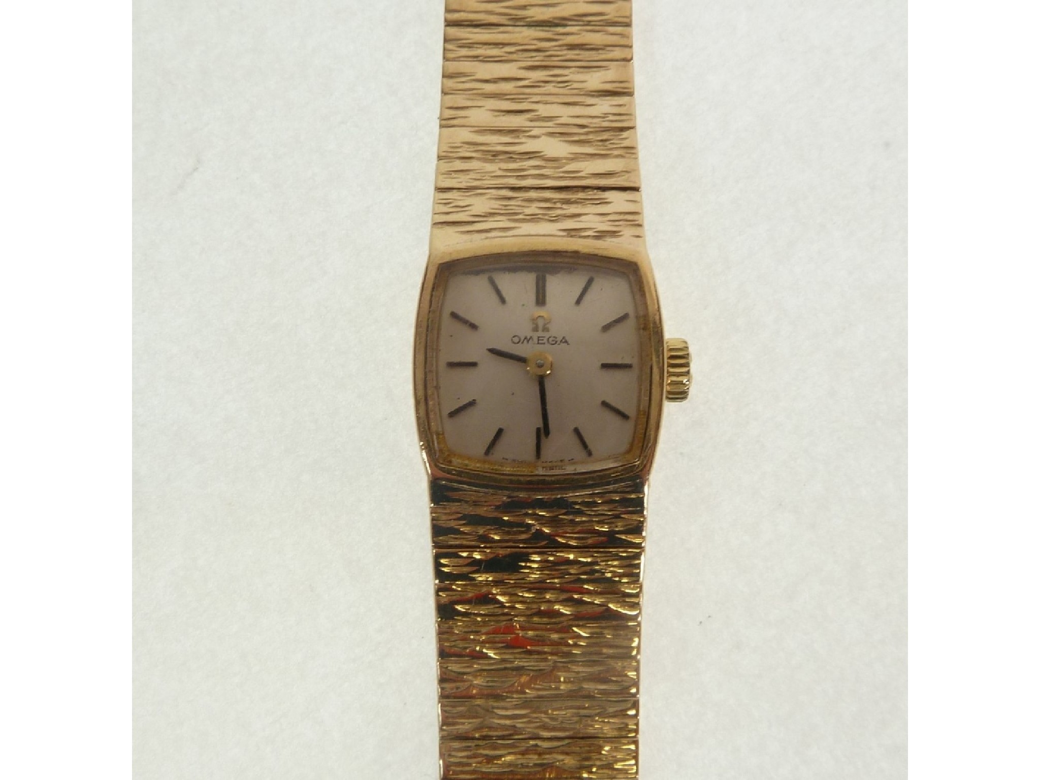 Appraisal: A LADY'S OMEGA CT GOLD BARK TEXTURED BRACELET WATCH mechanical