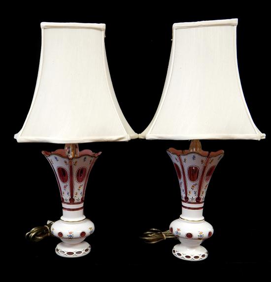 Appraisal: Pair of lamps converted from Victorian overlay white to cranberry