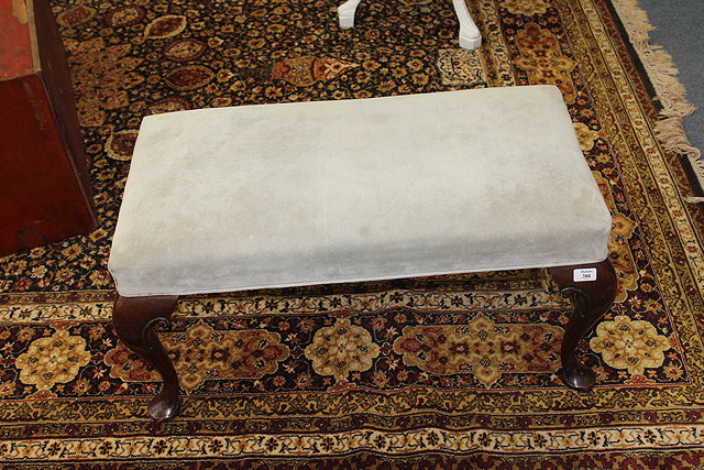 Appraisal: A GEORGIAN STYLE MAHOGANY RECTANGULAR LEATHER UPHOLSTERED STOOL standing on