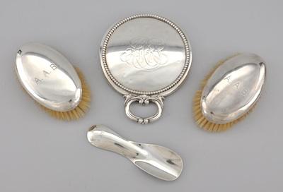 Appraisal: A Pair of Sterling Silver Clad Brushes a Shoe Horn